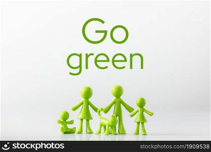 Green figures made of biodegradable plastic symbolic model of family with children Minimal ecology concept, protection of the environment. Green figures made of biodegradable plastic symbolic model of family with children Minimal ecology concept. Go Green.