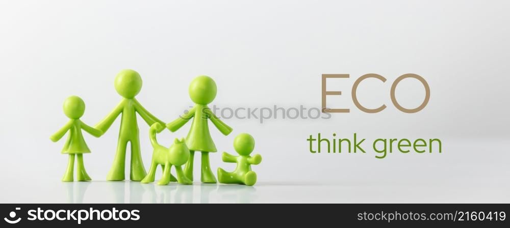 Green figures made of biodegradable plastic symbolic model of family with children Minimal ecology concept. Eco think green, protection of the environment. Green figures made of biodegradable plastic symbolic model of family with children Minimal ecology concept