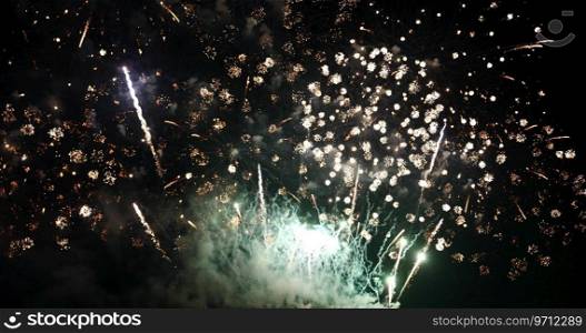 Green Firework celebrate anniversary happy new year 2022, 4th of july holiday festival. Green firework in night time celebrate national holiday. Countdown to new year 2022 festival party time event