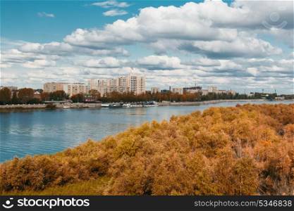 green forest, river, big sky and cityscape on the back
