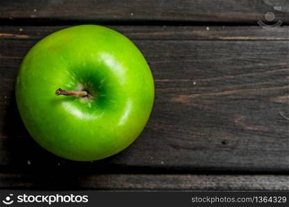 Green fresh Apple. On wooden background. Green fresh Apple.