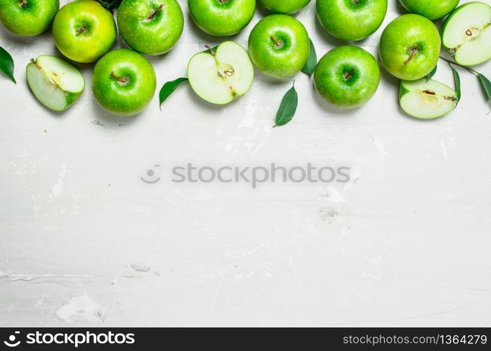 Green fresh apples. On white rustic background .. Green fresh apples.