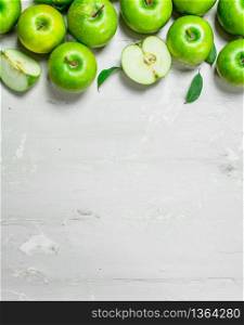 Green fresh apples. On white rustic background .. Green fresh apples.