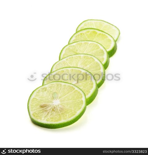 green fresh lime slices isolated over white background
