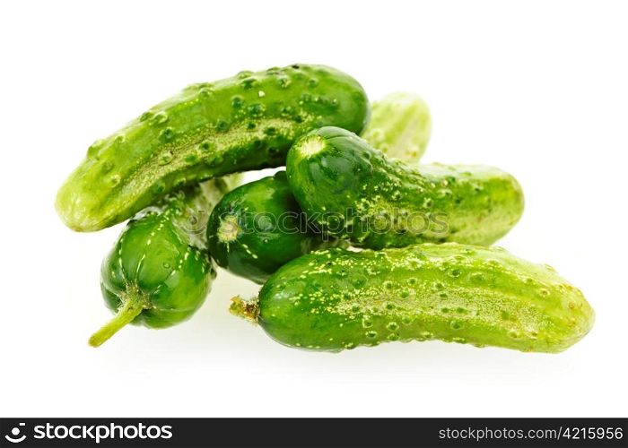 Green fresh small cucumbers isolated on white