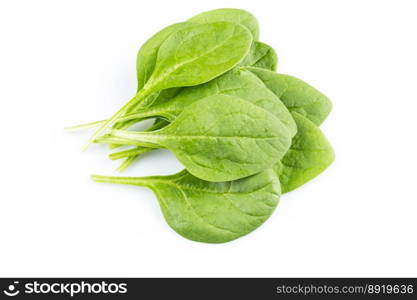 Green fresh spinach leafs on a white background