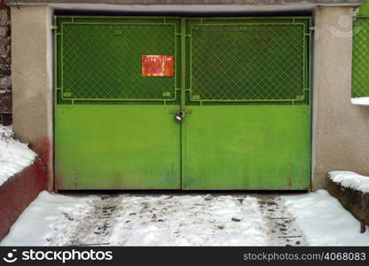 Green Garage door, Brasov, Transylvania, Romania.