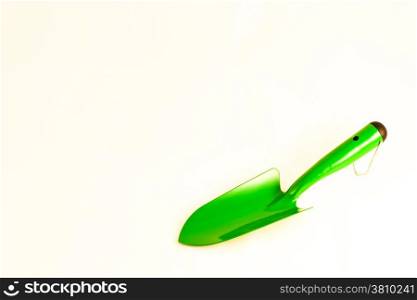 Green garden shovel isolated on white background with copy space