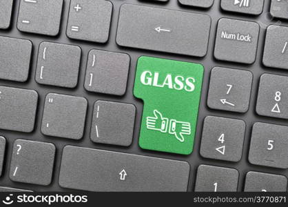 Green glass key on keyboard