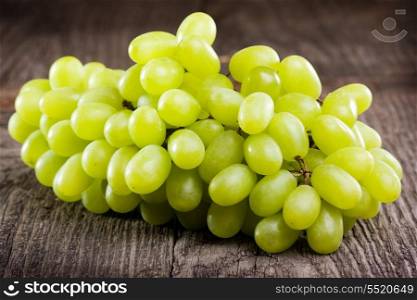 green grape on wooden table