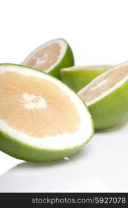 Green grapefruits on white background