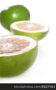 Green grapefruits on white background