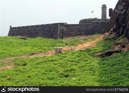 Green grass and wall of fortress in Galle, Sri Lanka