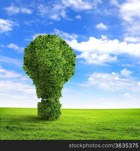 Green grass exclamation mark against blue sky