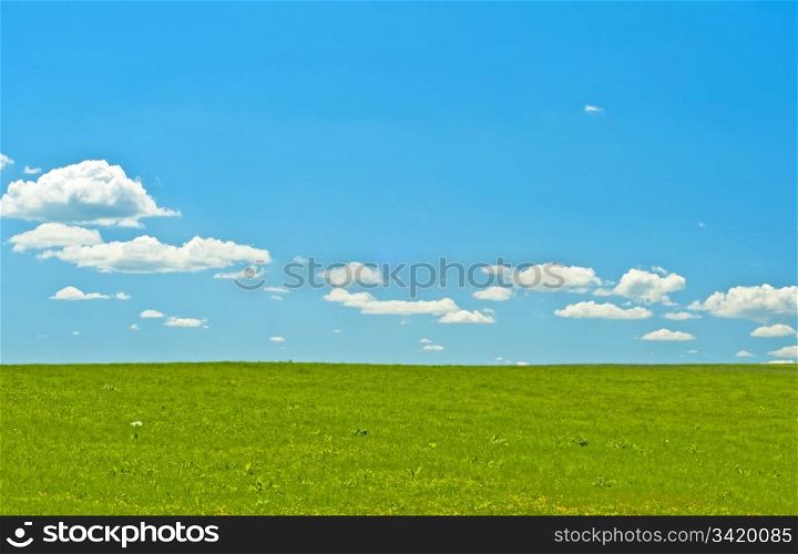 green . green with blue sky and clouds