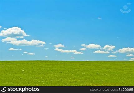 green . green with blue sky and clouds
