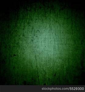 Green grunge background with a scratched texture