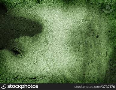 Green grungy background with crack and black paint
