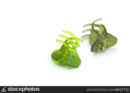 green hairpins isolated on white
