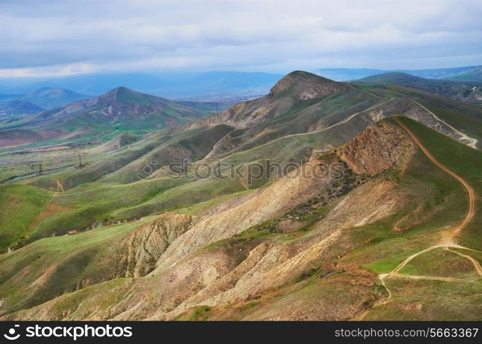 Green hills with road going through them