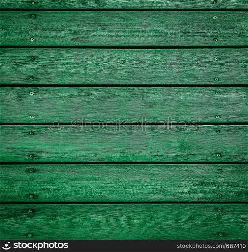 Green horizontal wooden texture for background or mockup. Rustic painted wood texture close up. Barn wall or fence. Flat wood banner, billboard or signboard. Colorful horizontal wooden texture for background or mockup.