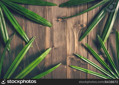 Green Ieaf background around old wood with space, Vintage toned.