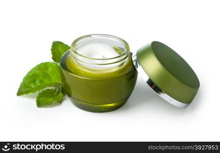 green jar of cream isolated on white background.