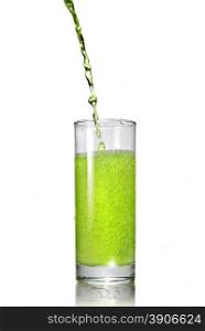 green juice pouring into glass isolated on white