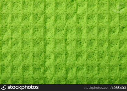 Green kitchen sponge rubber foam as background texture