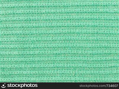 Green Knitting Texture or Knitted Texture Background in macro style. Knitting Texture or Knitted Texture in vintage style for design