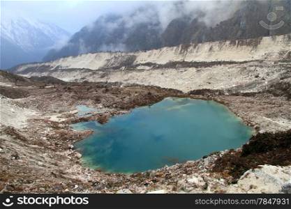 Green lake and mountain near Bimtang in Nepal