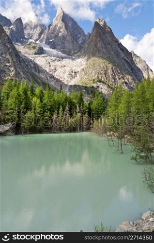 Green lake in Mont Blanc massif, Italy.