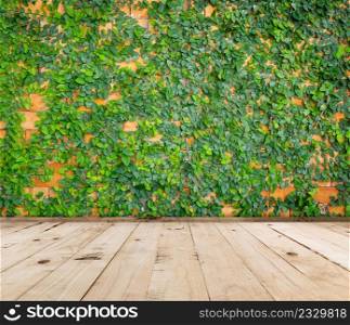 green leaf background and wood floor with space