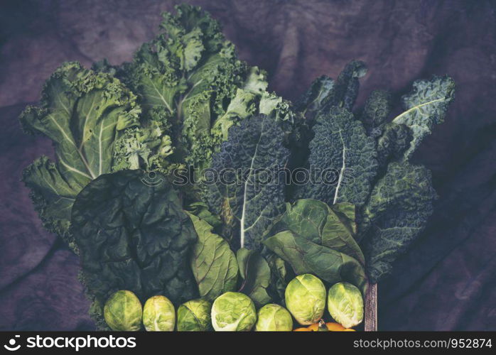 Green leafy vegetables on vintage background