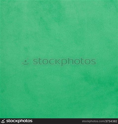 Green leather texture closeup background.