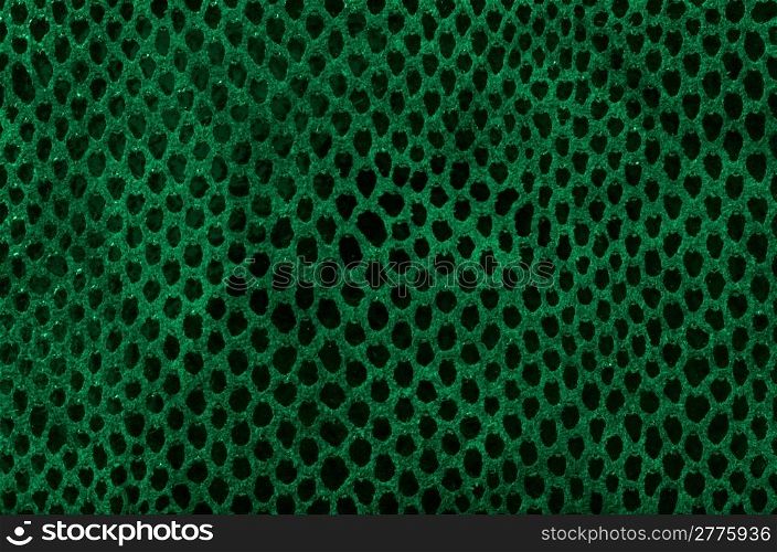 Green leather texture closeup detailed background.