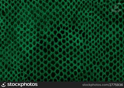 Green leather texture closeup detailed background.