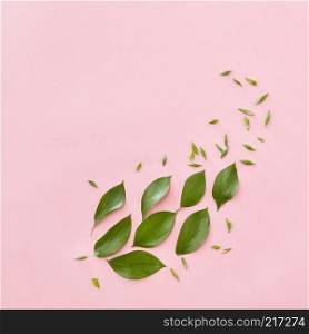 Green leaves represented in form of big leaf over pink background. Blank space may be used for noting your ideas, emotions, etc. Texture concept.. Green leaves isolated