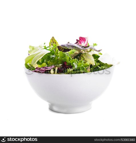 Green leaves salad in a bowl on the white