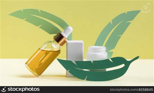 green leaves with serum bottle