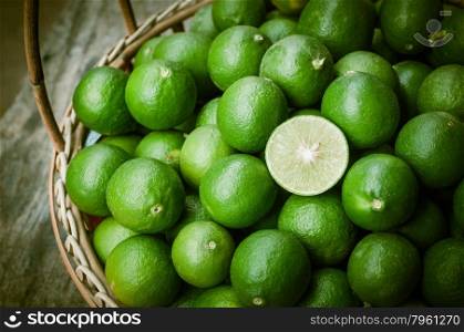 Green lemon in rattan basket