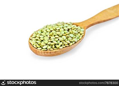Green lentils in a wooden spoon isolated on white background