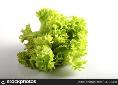 Green lettuce in kitchen. Isolated on white