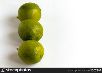 Green Lime Isolated. Whole Organic Citrus Fruit. Clipping Path Isolated on white Background. Fresh Limes Group for Citric Coctail or Lemonade. Juicy Vitamin Ingredient for Raw Vegetarian Food. Green Lime Isolated. Whole Organic Citrus Fruit