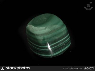 green malachite in front of black background
