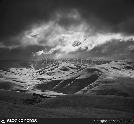 Green mountain hills during the epic sunset. Natural monocrome landscape.