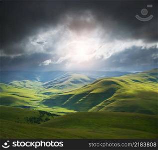 Green mountain hills during the epic sunset. Nature landscape.
