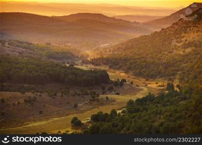 Green mountain landscape in the morning light, hilly land in Burgos Spain.. Mountain view in morning light, Burgos Spain.