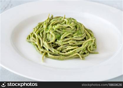 Green noodles with broccoli creamy sauce