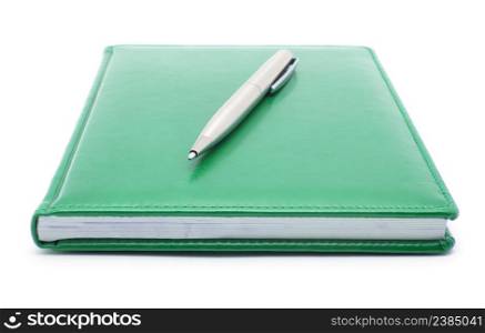 green notebook and pen isolated on white